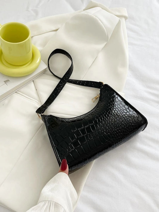 bolso baguette con cocodrilo negro